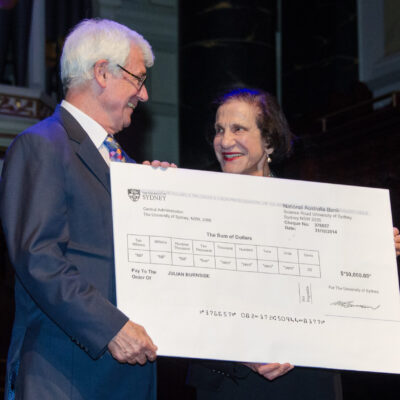 Governor General Marie Bashir gifts 2014 Peace Prize recipient, Julian Burnside, the $50,000 prize money
